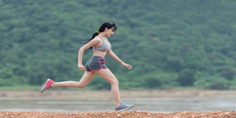 A skinny young woman running.