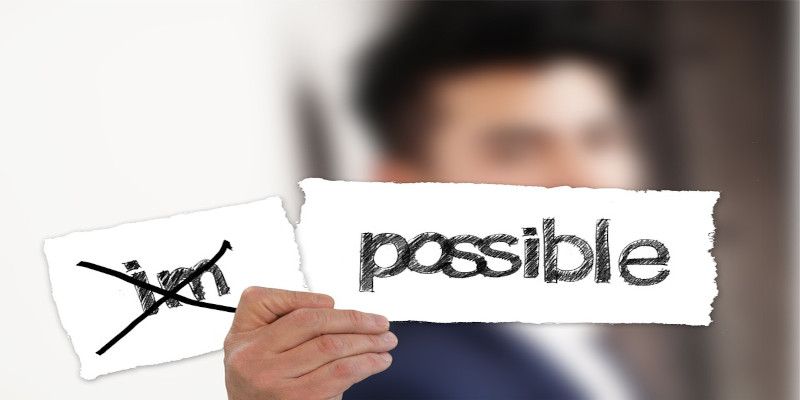 The word “impossible” written with the letters “im” cut off and crossed out.