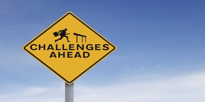 Sign saying “Challenges ahead.”
