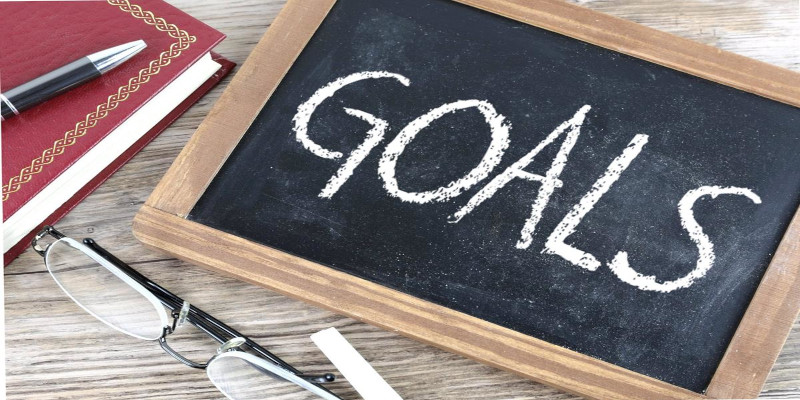 Image of the word “goals” written on a small blackboard with chalk.
