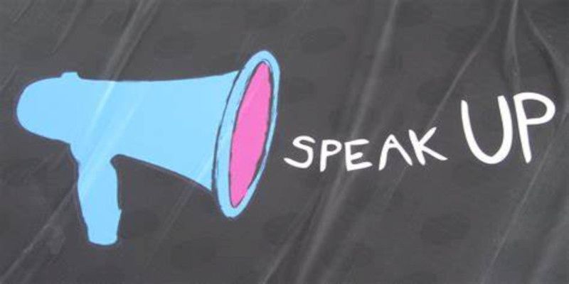 Illustration of a microphone and the words “speak up”, coming out of it.