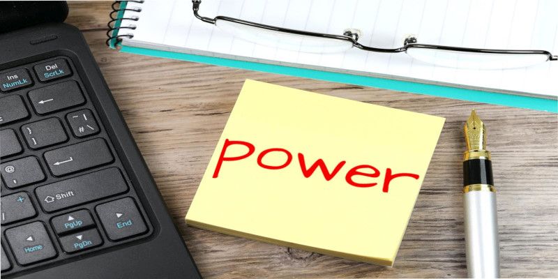 Image of a post-it note with the word “power” written in red.