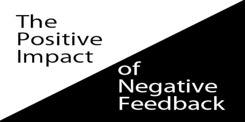 Two triangles with the words “the positive impact of negative feedback.”