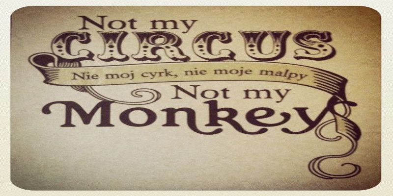 “Not my circus, not my monkeys” quote in both English and Polish languages.