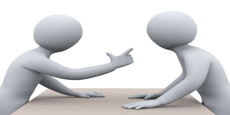 Illustration of two clip art figures, with one pointing his finger and the other standing menacingly, signifying a conflict.