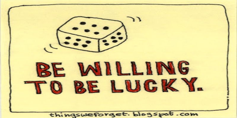 The quote, “be willing to be lucky” written on a yellow background.