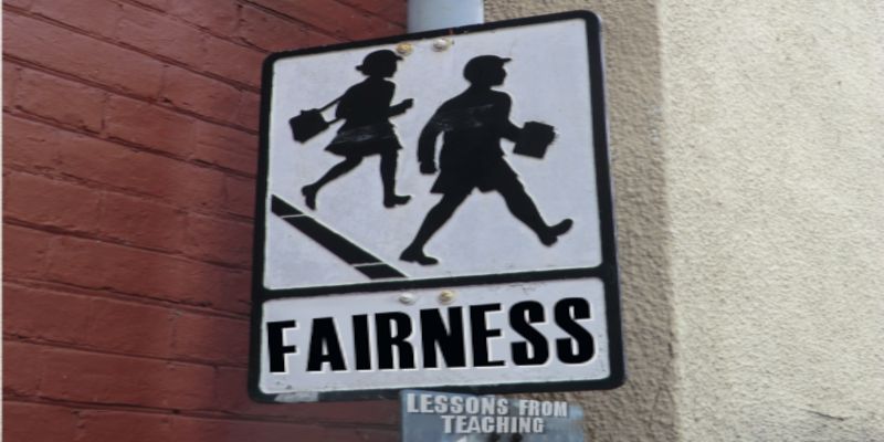 A sign saying “fairness”, with both a man and a woman painted on it.