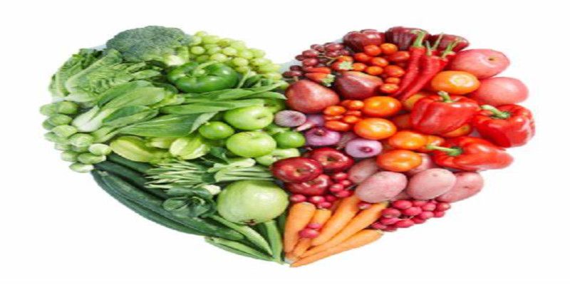 Image of healthy foods being laid down in a manner that they represent a heart.