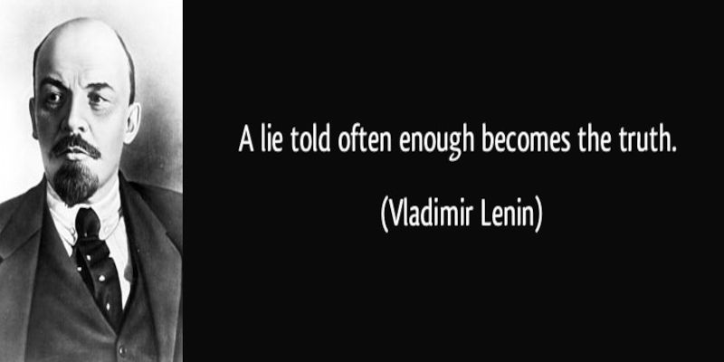 Image of the quote, “a lie told often enough becomes the truth” written in white letters by Vladimir Lenin.