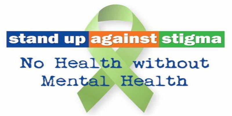 The quote, “stand up against stigma, no health without mental health” written on a white background.