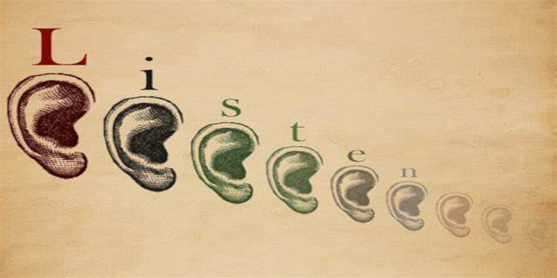 Illustration of multiple ears with each ear holding one letter of the word “listen.”