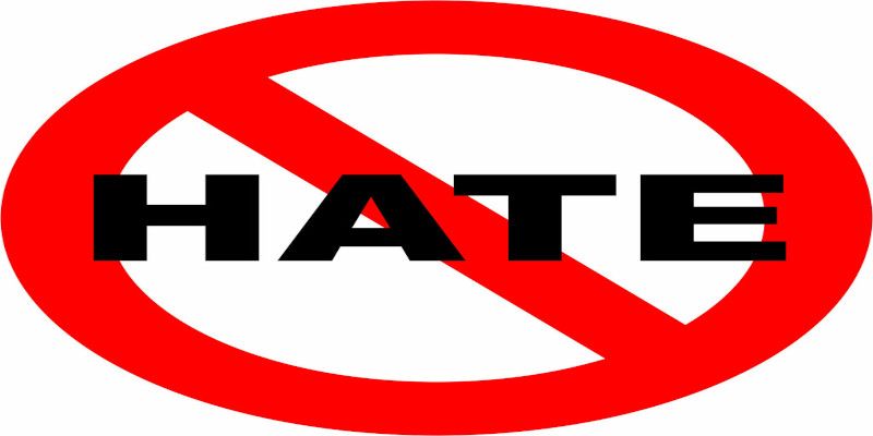 Illustration of a prohibition sign with the word “hate” written on it. This indicates that hating on others is forbidden.