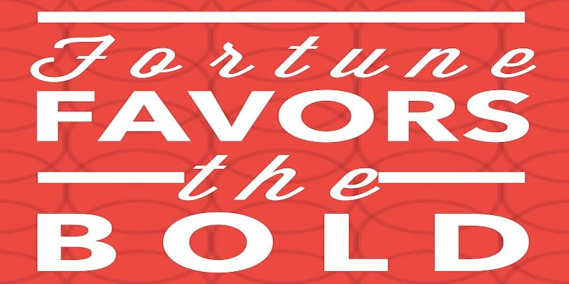 The quote, “fortune favors the bold” written in white letters on a red background.