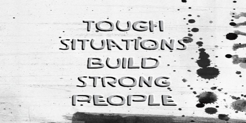 The quote, “tough situations build strong people” written on a background.