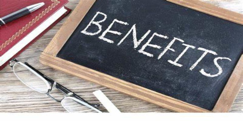 Image of a blackboard with the word “benefits” written on it with white chalk.
