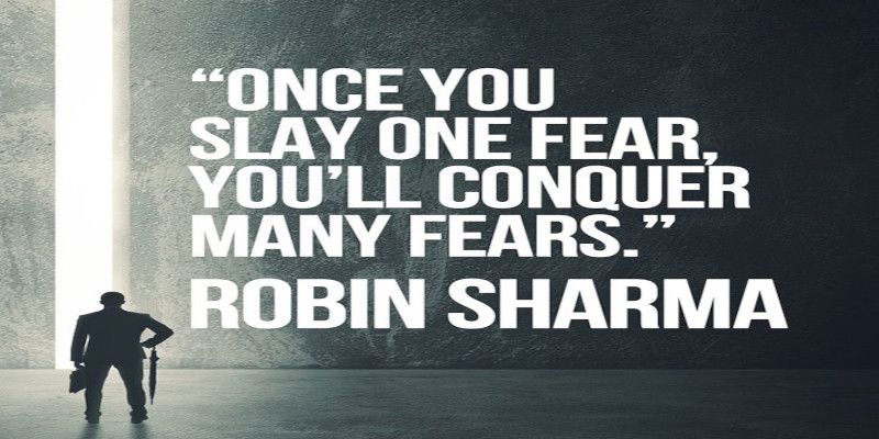 The quote, “once you slay one fear, you'll conquer many fears” written in white letters. By Robin Sharma.