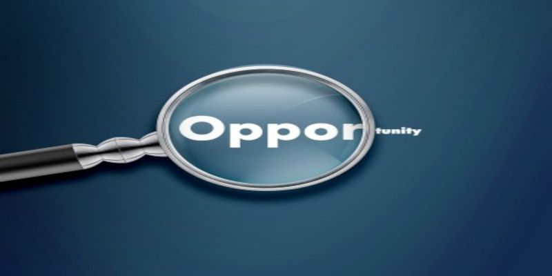 Illustration of a magnifying glass going over the word “opportunity” indicating that it's searching for an opportunity.