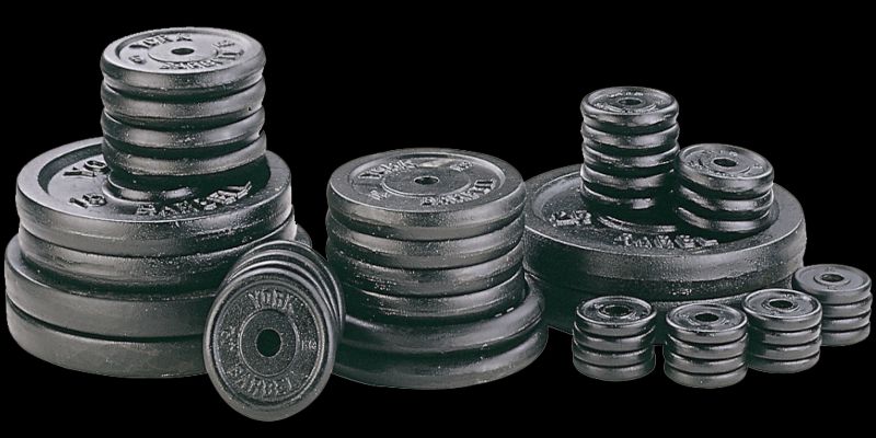 Image of multiple weight plates of different weight.