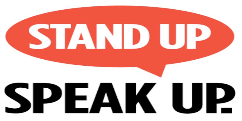 A sign reading, “stand up, speak up.”