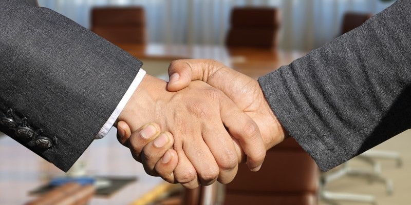 A handshake between two businessmen.