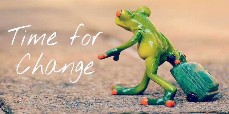The quote, “time for change” written with an illustration of a frog moving out with a suitcase.
